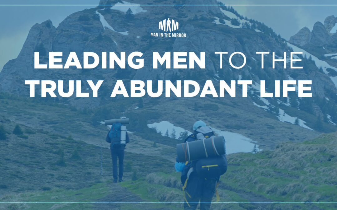 Text: Leading Men to the Truly Abundant Life, Image: two men hiking up a mountain