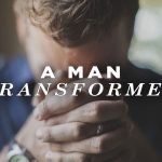 A Man Transformed (man with his hands folded and head down)