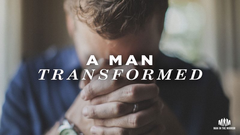 A Man Transformed (man with his hands folded and head down)