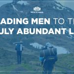 Text: Leading Men to the Truly Abundant Life, Image: two men hiking up a mountain