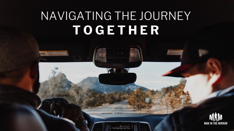 Men on a road trip navigating the journey together