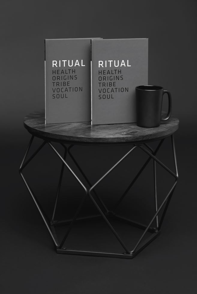 Ritual journals on table with coffee mug